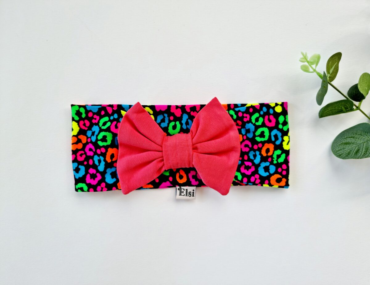 Neoontäpidega tumeroosa lipsuga peapael Neoontäpidega tumeroosa lipsuga peapael