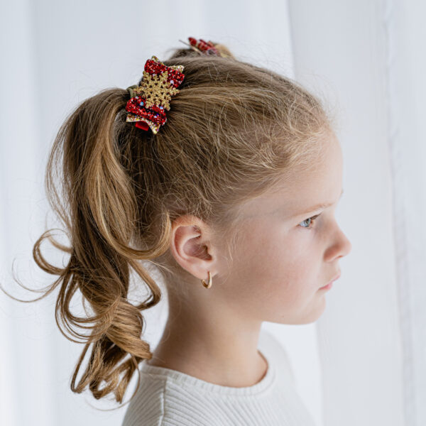 Kroko-klamber punane lumehelbega