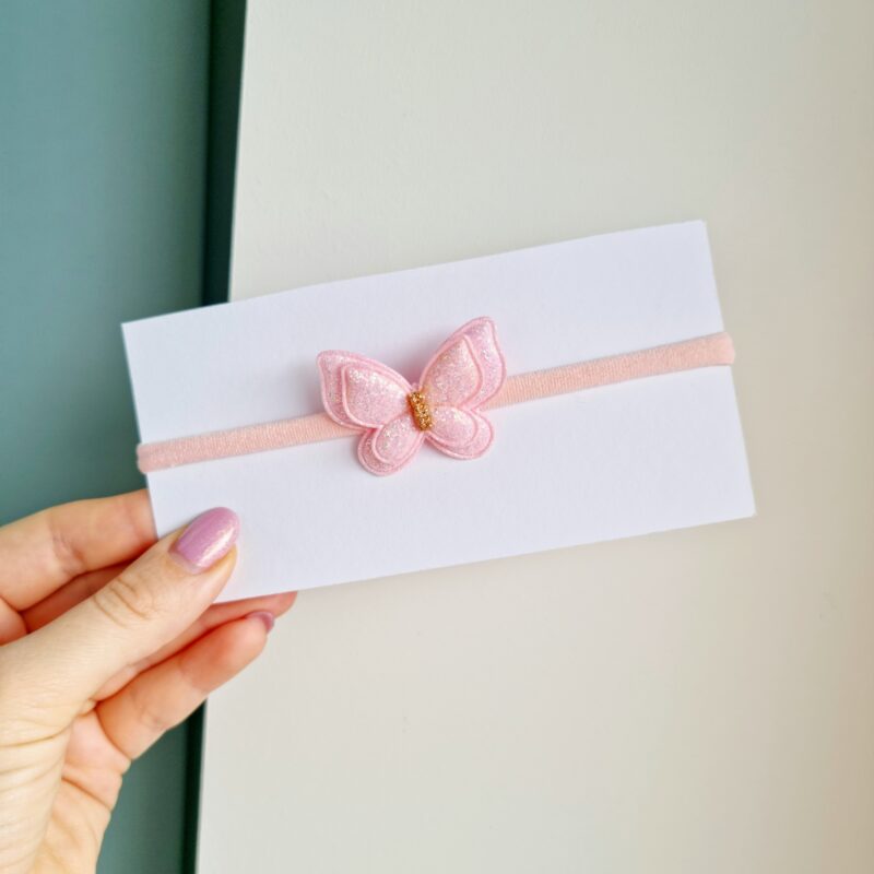 Läikiv liblikas heleroosa