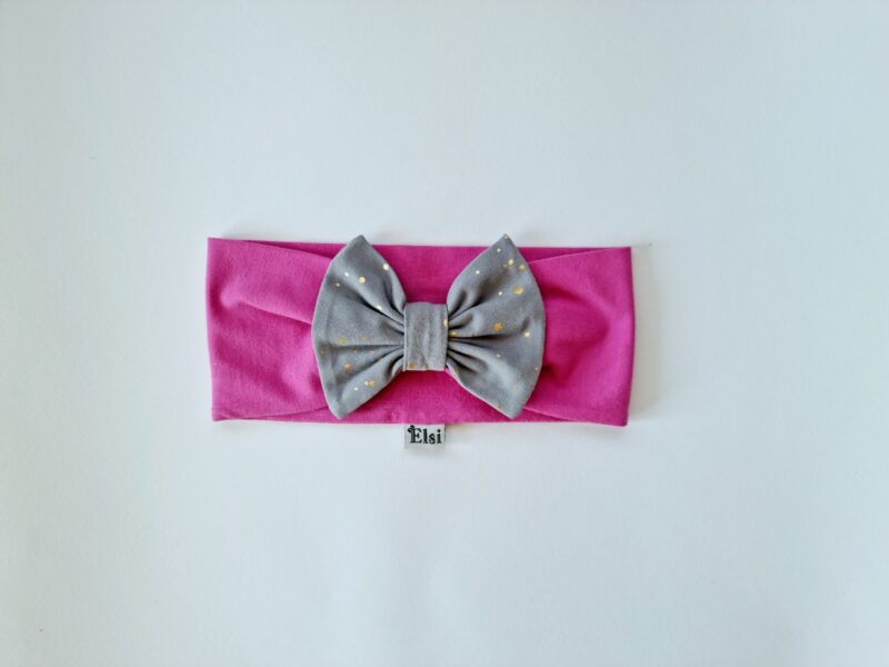 Tumeroosa peapael hallil kuldsed täpid