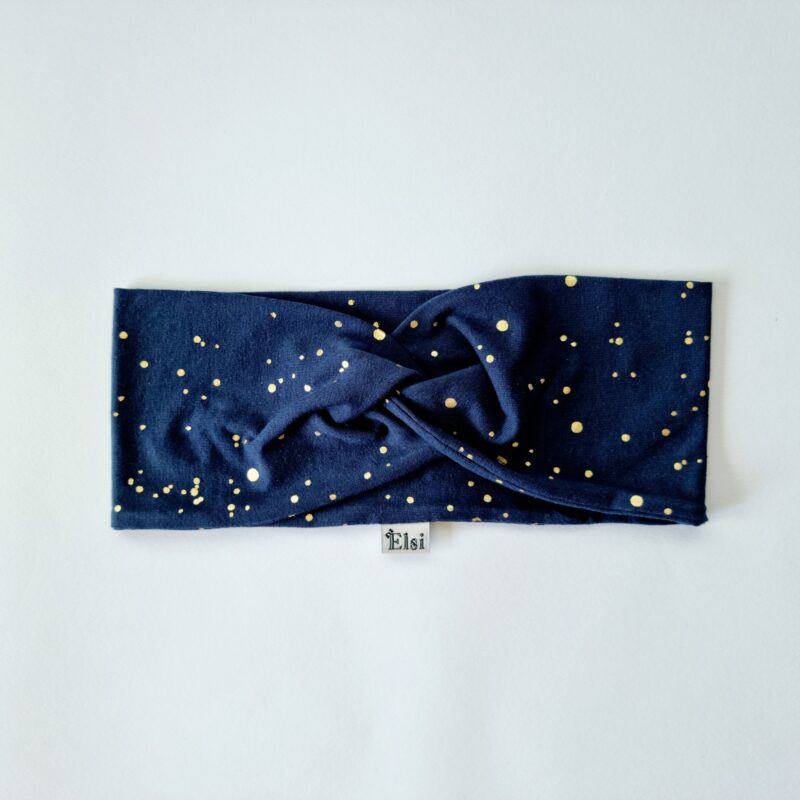 Tumesinine kuldsete täppidega