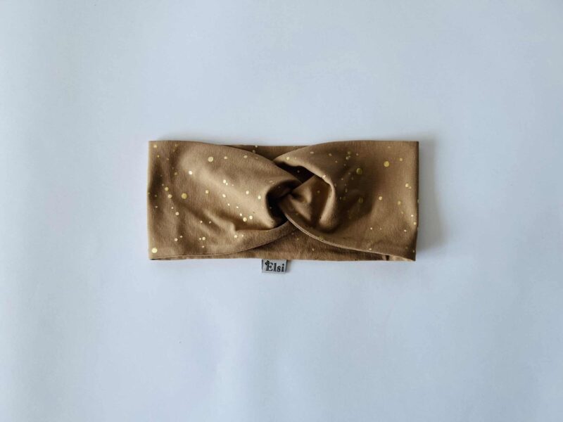 Meriinopeapael sinepil kuldsed täpid