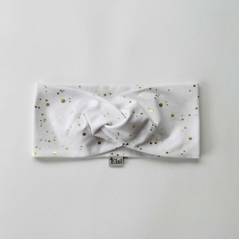 Valgel kuldsed täpid