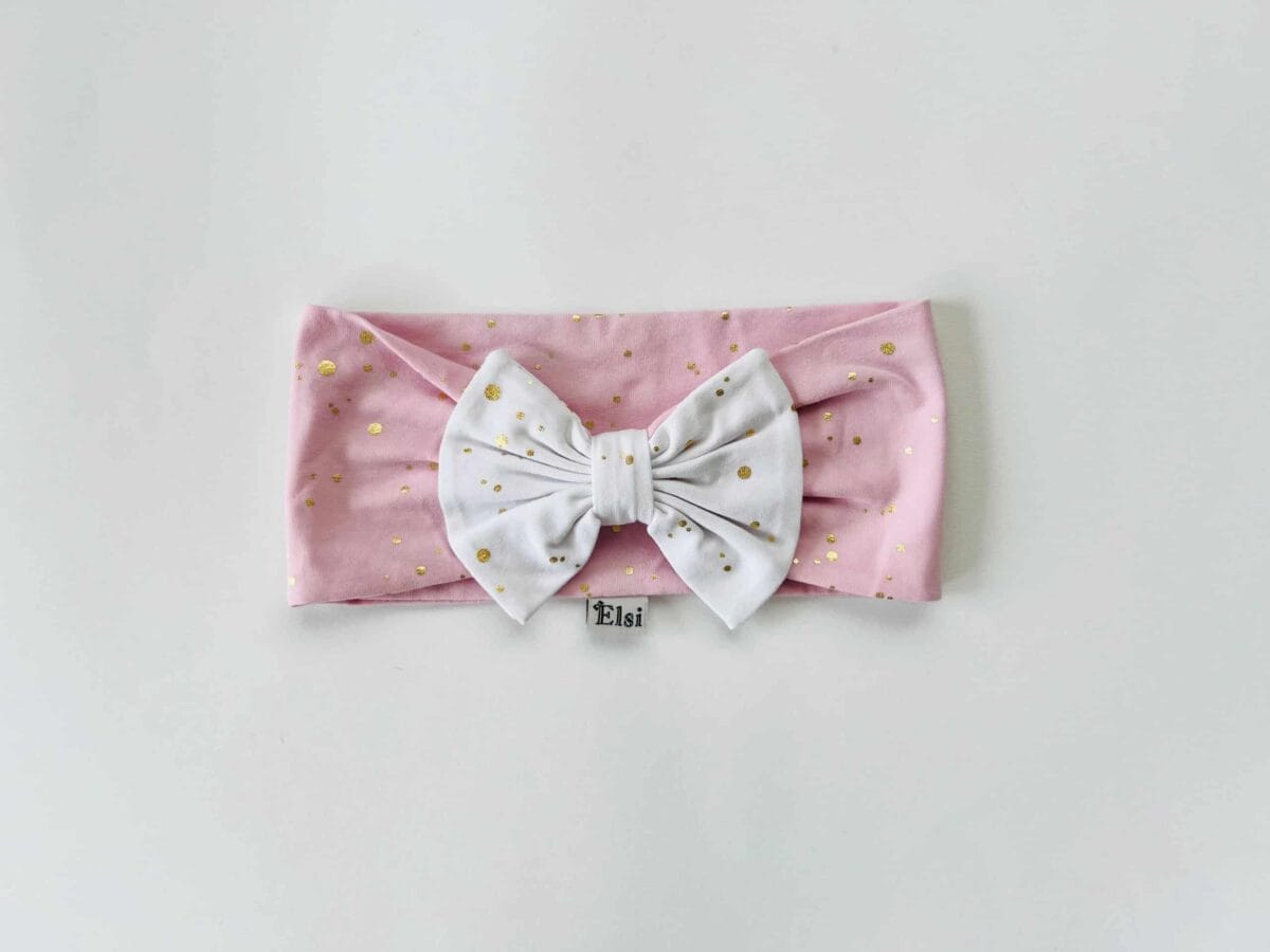 Roosa peapael valgel kuldsed täpid