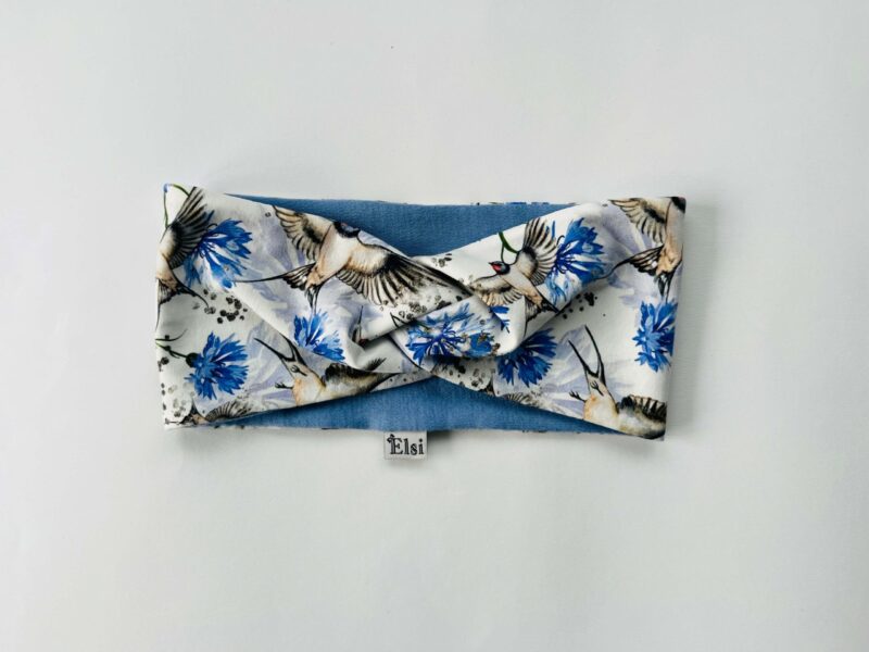 Meriinopeapael pääsukesed ja rukkililled